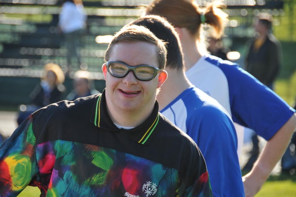 A Special Olympian smiles before the game begins.
