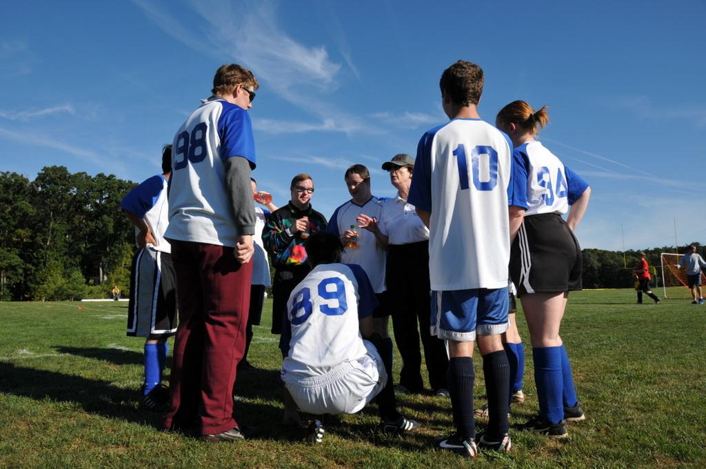 After the game, players huddle to discuss their performance.