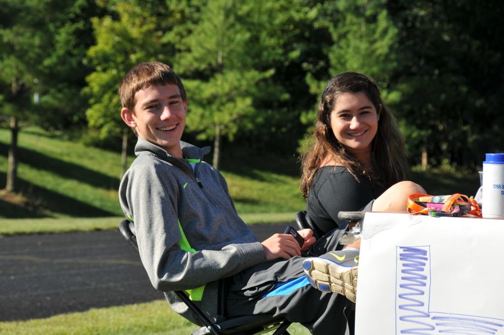 Two volunteers, senior William Breen and junior Lili Jalai, keep score for the games.