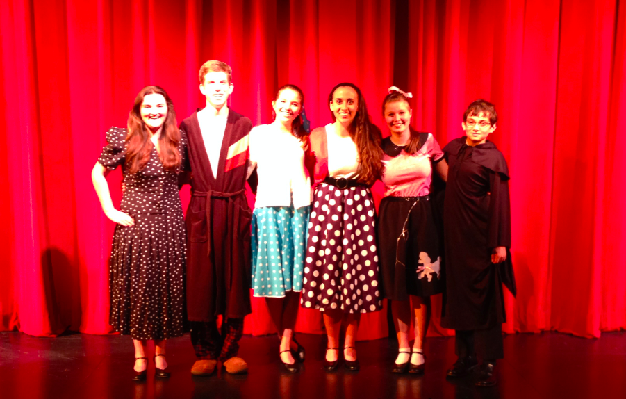 Cast members pose after the opening performance.