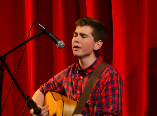 Metz sings and plays guitar at the FHS Variety Show. 
Photo credit: Kaitlin Corsi