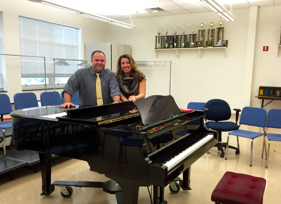 Dr. Scott and Mrs. Pramstaller are working in the choir room. 