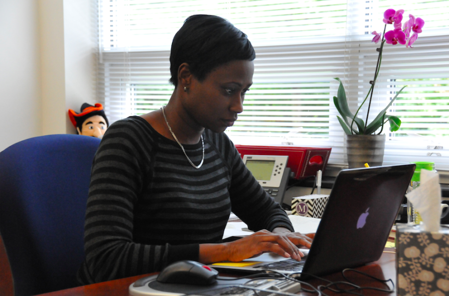 Mia+Burton%2C+Director+of+Diversity+and+Inclusion%2C+replies+to+emails+in+her+office.+