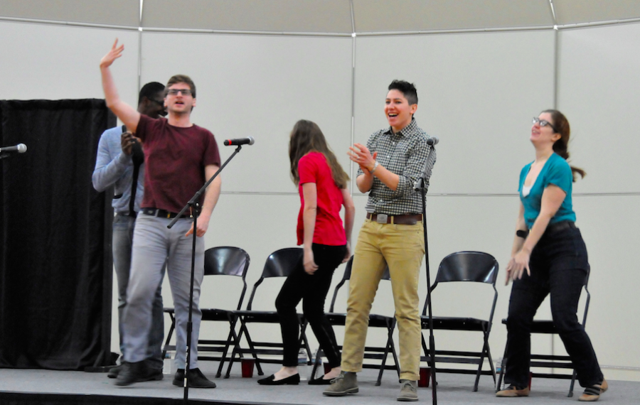 Members of the group Speak About It have fun as they run onstage for the show.