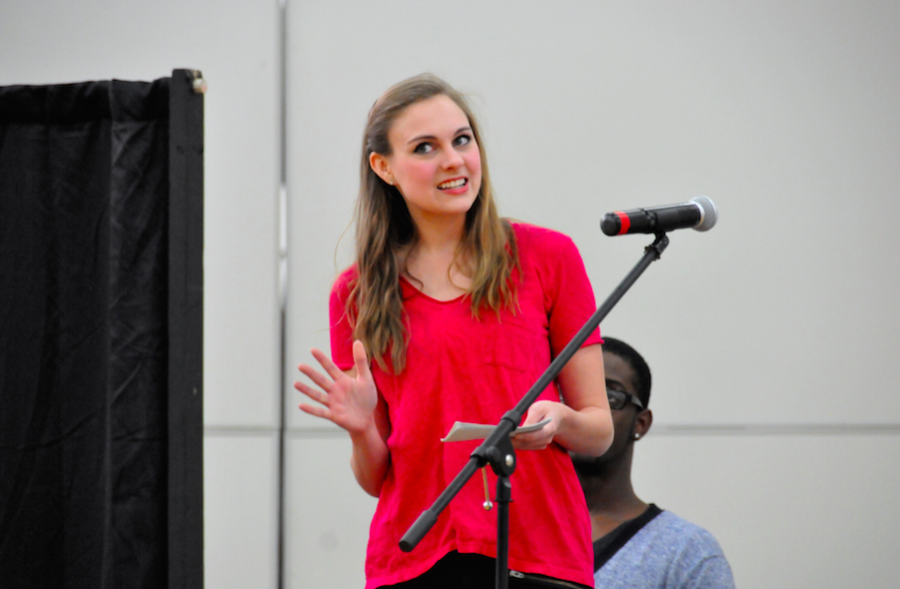 An actress from Speak About It performs a skit. 