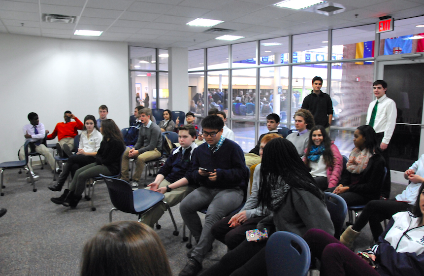 Students engage in a post-presentation discussion with facilitators from Speak About It.