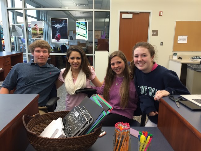 Huskies establish their Tundra Tools business in the library. 
From left: Junior Adam Shively, Senior Claire Rodriguez, Junior Kate Zecca, Sophomore Mackenzie Sidor