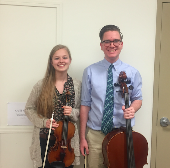 Junior Sydney Ebersohl and sophomore Patrick Lovelace pose with their respective instruments.