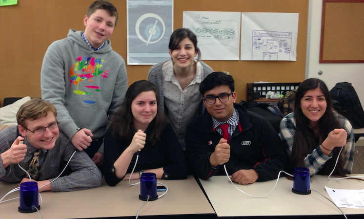 Six Quiz Bowl club members pose for a photo, buzzers at the ready. From Right: junior Jack Lovelace, sophomore Merritt Schwartz, senior Varvara Troitski, junior Lena Cohen, sophomore Sayeed Akhtar, and junior Trini Kechkian.