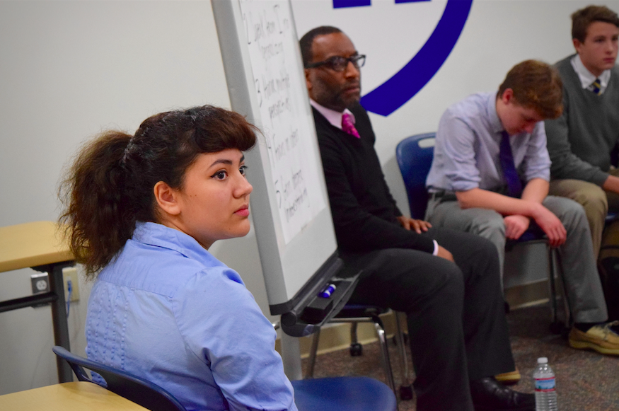 Senior Ekaterina Gaetjens and Upper School Director Rico Reed listen to a student speak at one of the diversity forums.