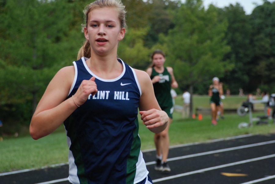 Sophomore Kate Nelson runs for the Cross Country Team. Photo credit: Victor ONiell Studios