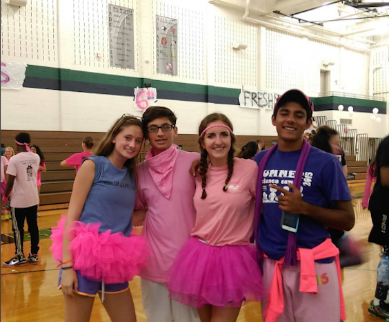 Sophomores Julie Ellison, Ethan Naidu, Lauren Meier, and Shiv Lamba pose for a picture after the pep rally on Friday.
