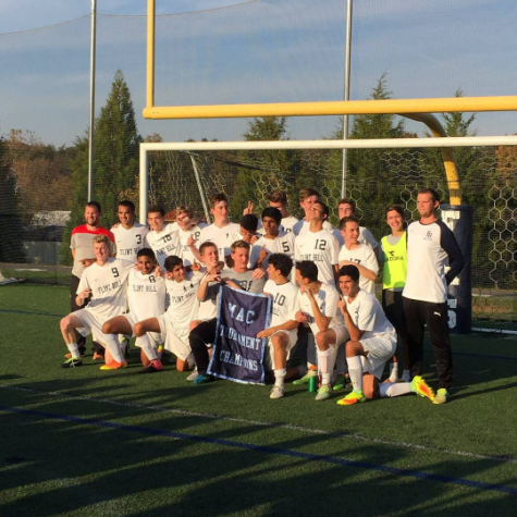 Varsity Boy's Soccer poses after winning.
