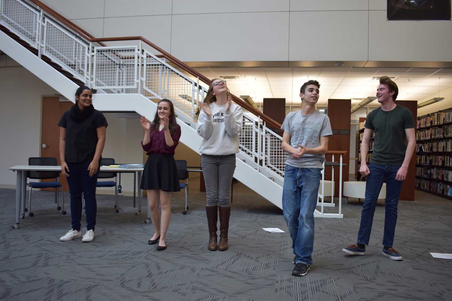 Freshman Jansi Patel, sophomore Hannah Yasmin Khan, Kramer, sophomore Sebastian Van Der Weide, and freshman Calvin Lucido revel in the applause.