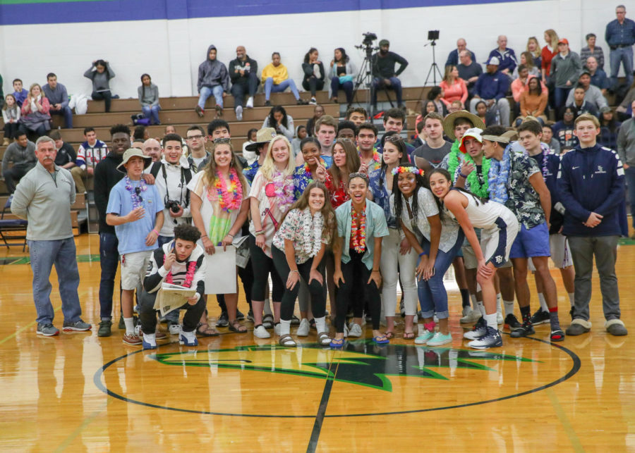 Students who attended the Winterfest games pose in the middle of the gym.