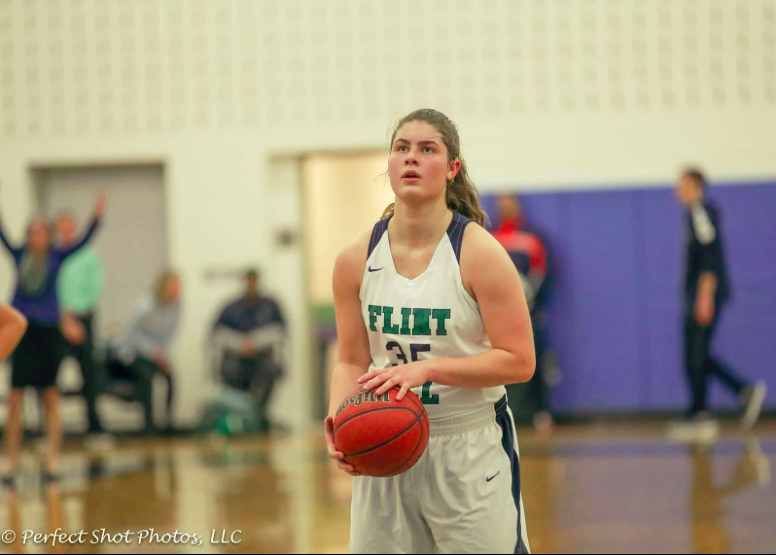 Junior Claire Miller composes herself before shooting a free throw for the Varsity Girls Basketball team.