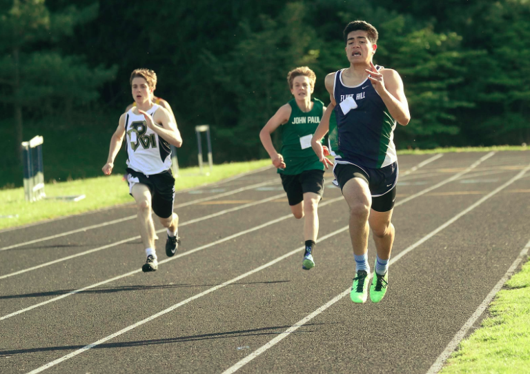 Senior Craig Hunt sprints the last few meters of his race, pulling ahead of his other competitors.