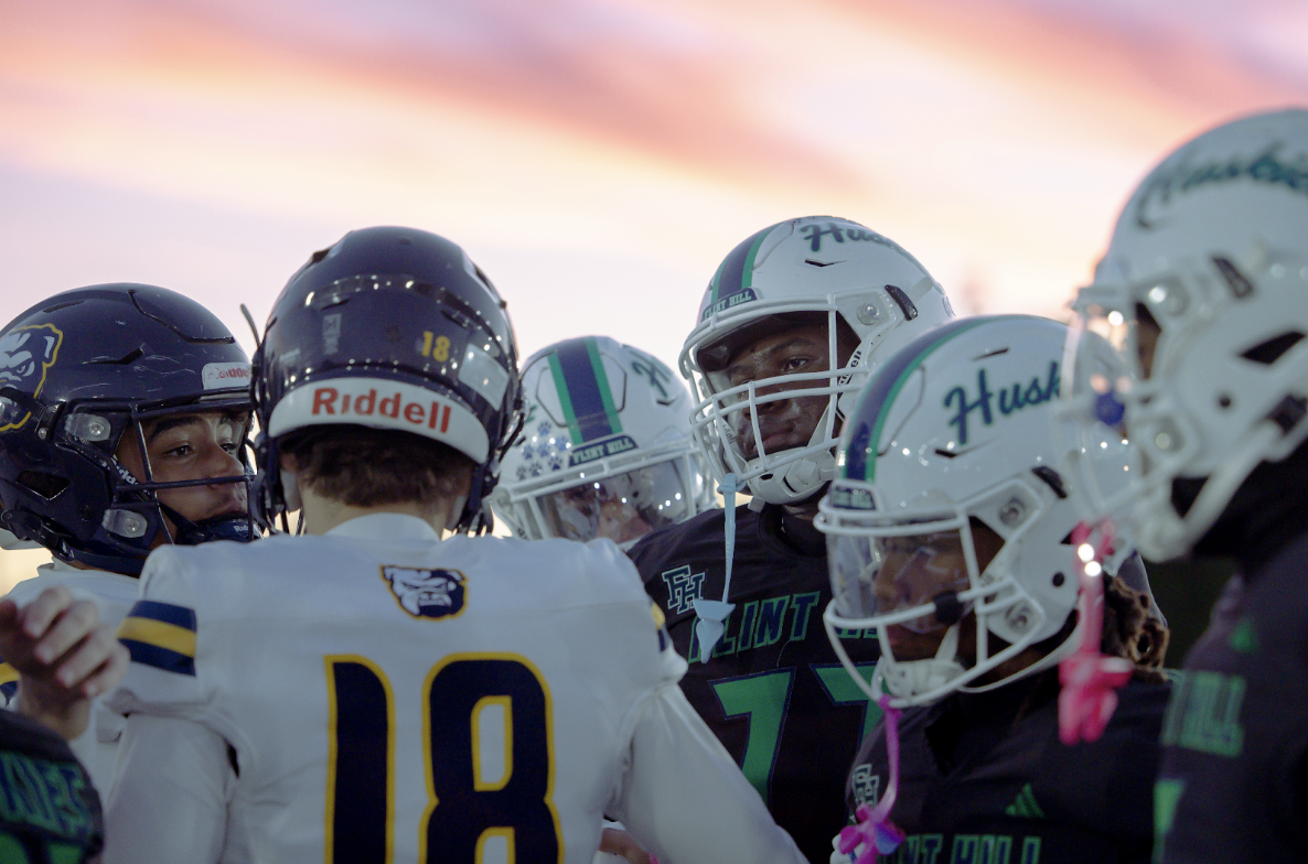 Flint Hill and Bullis football captains meet before the game.
