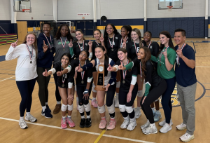 Flint Hill Girls' Varsity Volleyball poses for photos after winning the championship match.