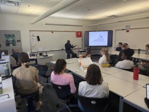 Students sit in for Biggs' presentation